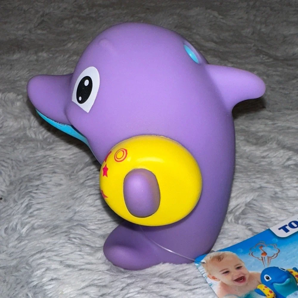 TOMY Water Whistlers Purple Dolphin Bath Toy E72379 Squirter Whistle 9m+